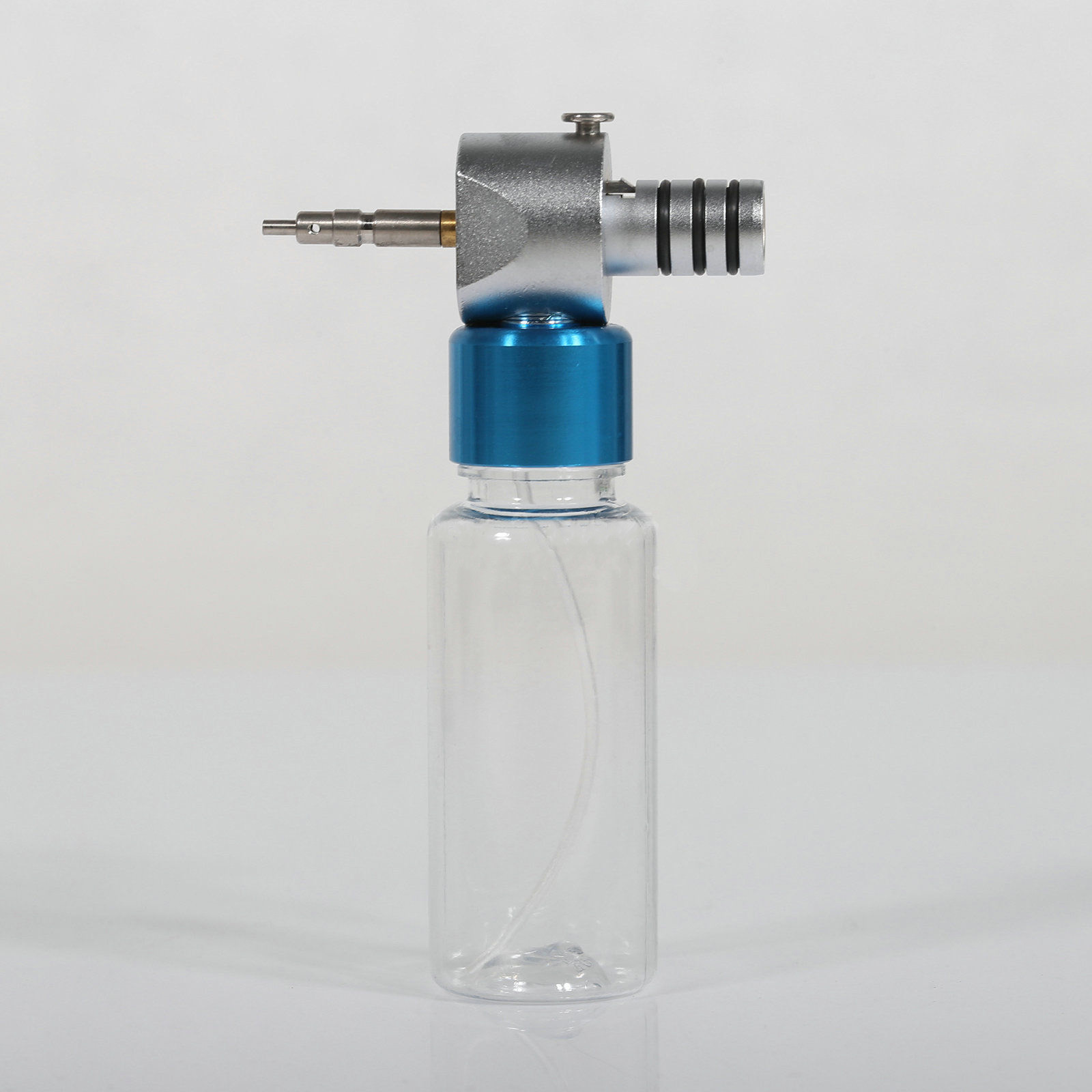 Dispositivo de Limpieza y Lubricación para Piezas de Mano Dentales de Baja Velocidad