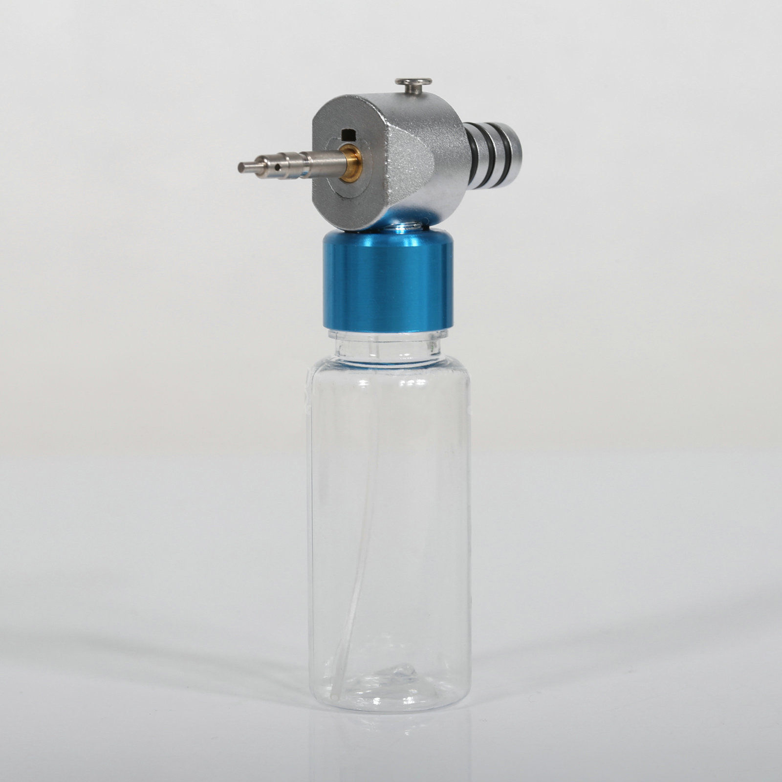 Dispositivo de Limpieza y Lubricación para Piezas de Mano Dentales de Baja Velocidad