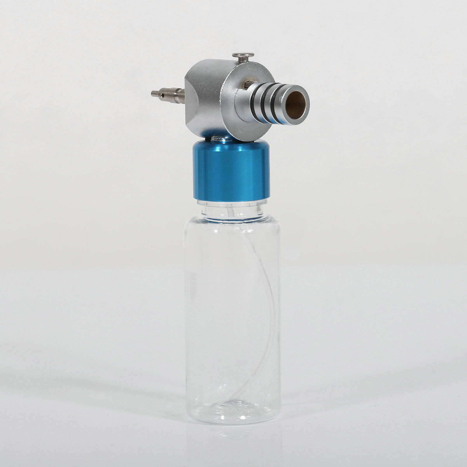 Dispositivo de Limpieza y Lubricación para Piezas de Mano Dentales de Baja Velocidad